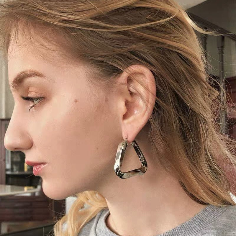 18K gold hollow triangle with irregular twisted design simple personality earrings-Luxore