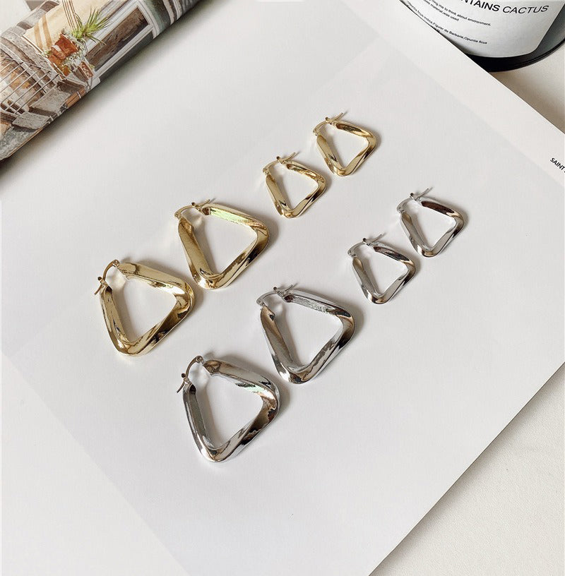 18K gold hollow triangle with irregular twisted design simple personality earrings-Luxore