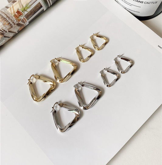 18K gold hollow triangle with irregular twisted design simple personality earrings-Luxore